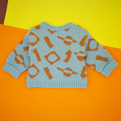 Back of mint and orange jaquard knit children's jumper in wool.